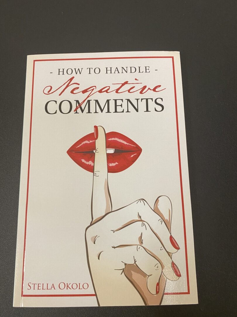 A book cover with a hand and lipstick on it.